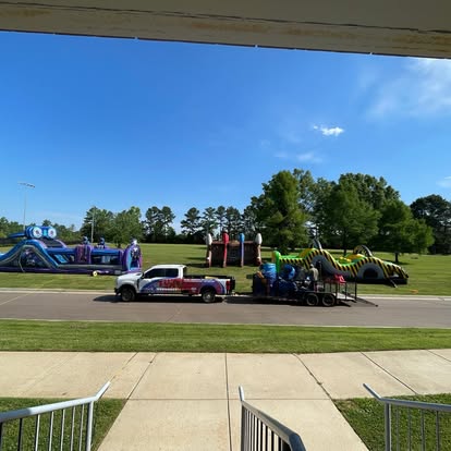 FunVentures truck on site with inflatables already standing on the field