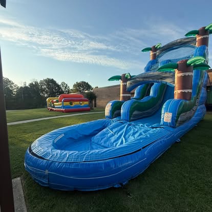 A tropical water slide set up on a Central Mississippi lawn